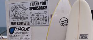 two surfboards and thank you sponsors sign