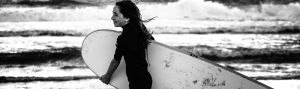 young girl with surfboard