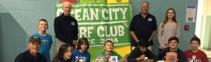 kids in front of ocean city surf club sign