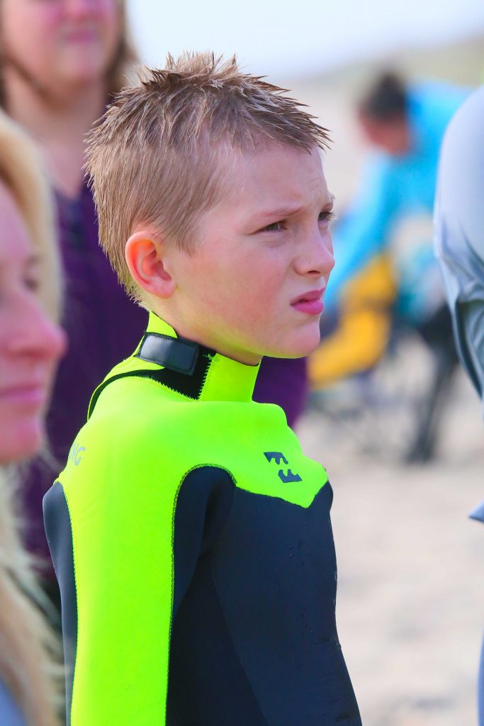 small child in wetsuit
